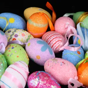 Assorted colorful Easter foam eggs with glitter and ribbon loops for hanging decoration