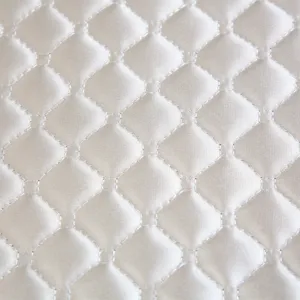 Détail du tissu de housse de chaise rembourré épais, texture brillante douce de haute qualité.