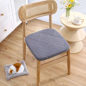 Grey textured chair cushion detail in home wooden chair scene, comfortable seat.
