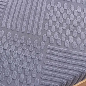 Thick fabric cushion detail view showing textured geometric pattern for comfort and style.