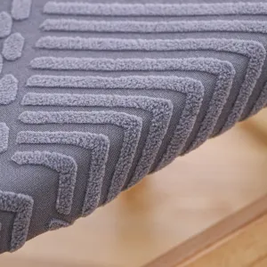 Thick seat cushion detail close-up showing soft textured fabric and raised stripe design for chairs.