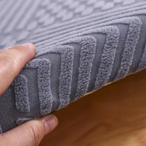 Thick grey seat cushion detail shot showing textured geometric pattern and fabric.