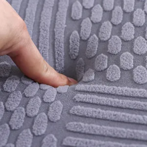 Close-up detail of the thickened grey seat cushion showing soft memory foam fabric texture.