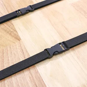 Black elastic fixing strap with plastic buckle detail view, durable accessory for car and office seats.