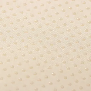 Anti-slip cushion fabric detail showing rubberized grip dots for secure placement.