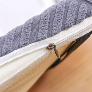 Thickened memory foam seat cushion detail shot with soft grey texture fabric and durable white zipper.