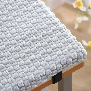 Thick plush chair cushion detail, grey textured memory foam seat pad for office or classroom use.