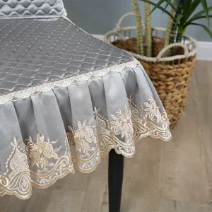 Quilted grey dining chair cover with lace ruffle embroidery, anti-slip all-inclusive design.