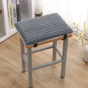 Thickened plush stool cushion in grey with textured surface, warm and comfortable for seating.