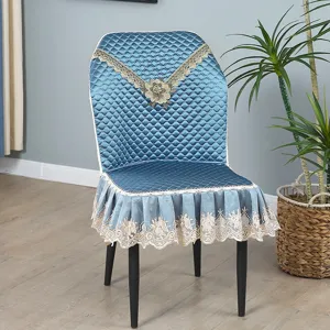 Blue quilted dining chair cover with elegant lace embroidery and integrated universal backrest.