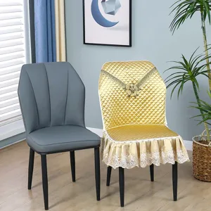 Details view of the luxury quilted chair cover and modern curved dining chair for home decoration.