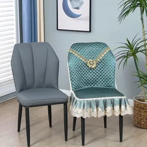 Quilted dining chair cover detail, lace embroidered edge design, elegant home interior scene display.