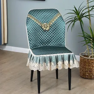 Quilted luxury green dining chair cover with elegant gold lace trim and ruffle skirt