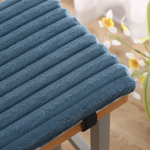 Detailed view of thickened blue plush striped chair cushion showing soft texture and straps.