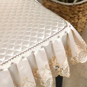 Quilted dining chair cover with elegant lace embroidery, slip-resistant universal fit.
