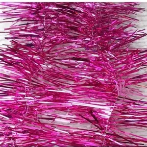 Detailed macro close-up view of shimmering pink Christmas tinsel garland party decoration