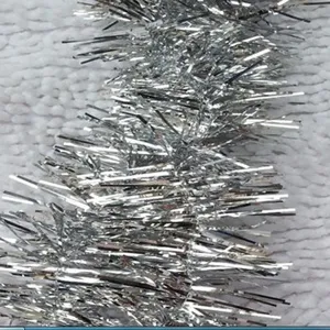 Macro detail of metallic silver Christmas tinsel garland showing textured fringe