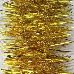 Detailed close-up view of shimmering metallic gold Christmas tinsel garland for festive decor