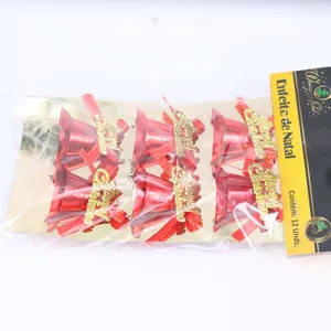 Detailed view of red Christmas bells with gold Merry Christmas lettering and bows