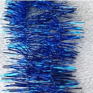 Detailed macro view of dense blue metallic Christmas tinsel garland for festive decor