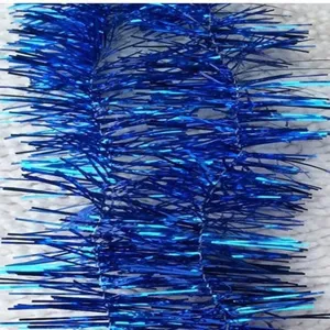 Macro view of shiny blue Christmas tinsel garland showing detailed metallic textures