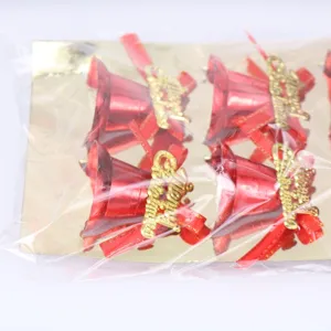 Detail of 6-piece red Christmas bells with gold Merry Christmas lettering and red bows