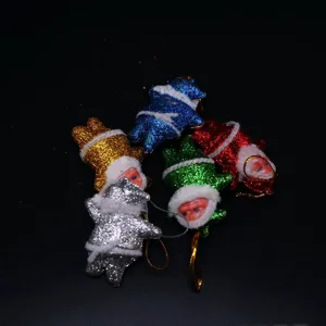 Piccoli ornamenti natalizi glitterati di Babbo Natale in vari colori