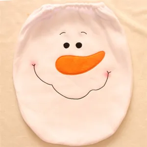 Close-up of white plush snowman toilet lid cover with cute face embroidery