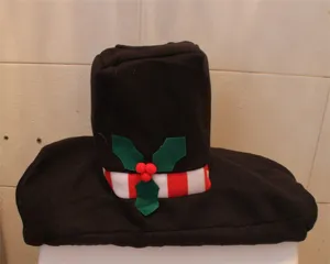 Detail view of the black snowman hat toilet tank cover with holly and red striped accents.