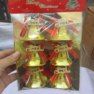 6-piece set of golden Christmas tree bell ornaments with red bows and Merry Christmas signs