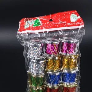 Set of colorful holographic Christmas drum ornaments in clear plastic packaging