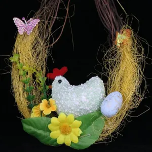 Detail of Easter vine wreath decoration with foam chicken, egg, and yellow flowers