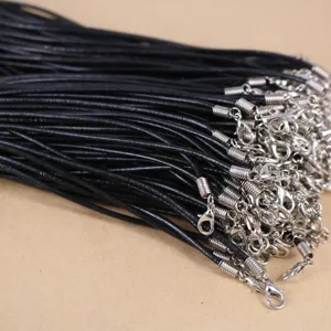 Detailed view of black wax cord necklaces with silver lobster clasps for DIY jewelry