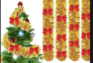 Festive golden Christmas tinsel garland with red bows for tree decoration details