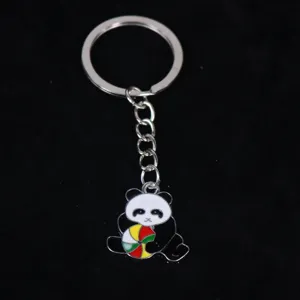 Cute enamel panda keychain pendant with colorful ball on black background