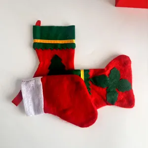 Pair of mini red and green Christmas stocking cutlery holders and festive hanging ornaments