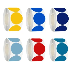 Macro view of six rolls of colorful round adhesive marking labels in various vibrant shades.