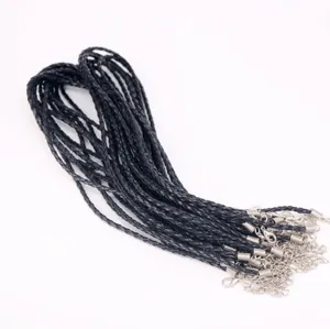 Detail showing bulk black braided necklace cords with lobster clasps and chains.