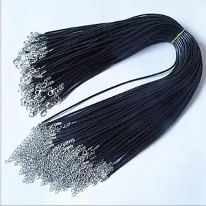 Detailed macro view of black DIY necklace cords with lobster clasp and extender chain