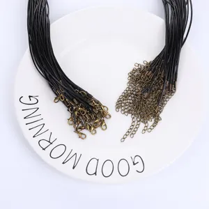 Detail view of black wax necklace cords with antique bronze lobster clasps and chains