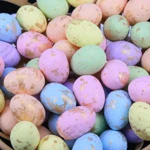 Set of colorful foam Easter eggs with gold foil flecks for festive holiday decoration.