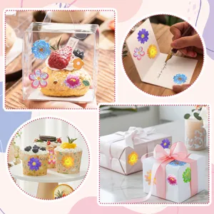 Close-up of holographic flower stickers applied on gift boxes, cupcakes, and cards.