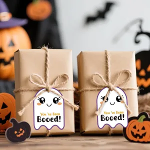 Close-up of cute Halloween ghost gift tags featuring You've Been Booed text and twine