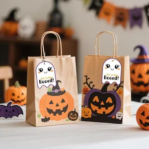 Macro view of cute ghost gift tags with You've Been Booed text on Halloween bags