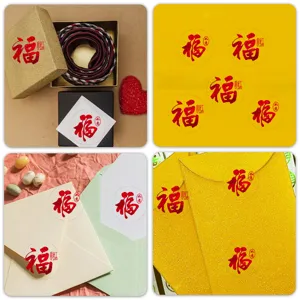 Detailed view of red Fu character festive seal stickers applied on gift boxes and envelopes