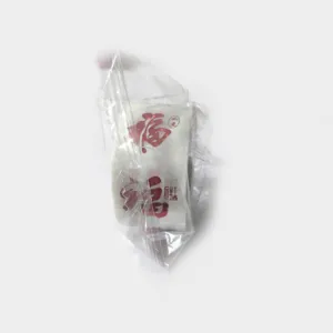 Detail view of red Chinese Fu character stickers in transparent plastic packaging.