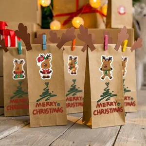 Close-up of cute Christmas reindeer stickers on brown kraft paper gift bags