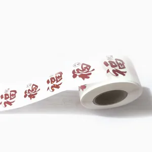 Close-up detail showing a roll of festive Chinese red Fu character sealing stickers