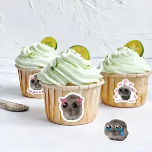 Funny sad hamster meme stickers applied to green lime cupcakes detail for DIY decoration