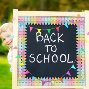 Close-up of cute crayon bulletin board border decorating a school chalkboard